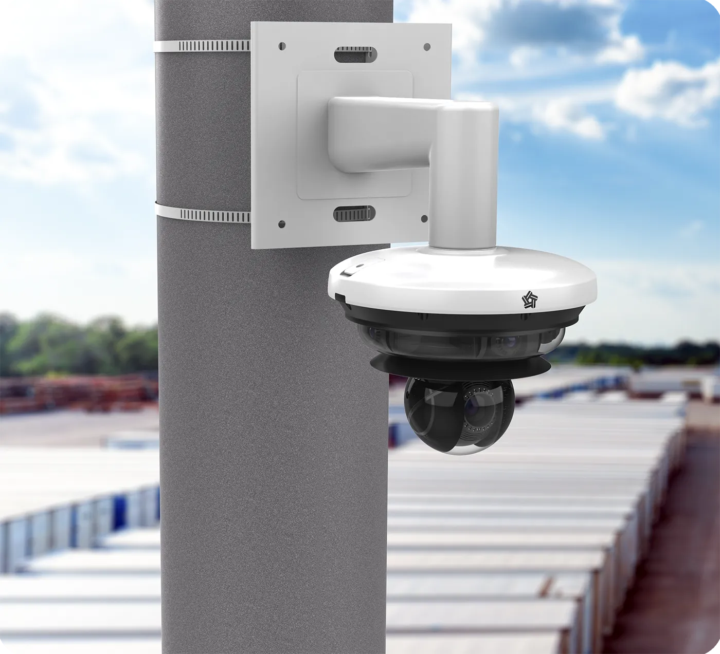 A modern, white 360-degree video camera attached to a pole on the hights